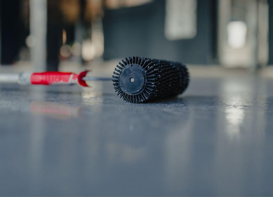Garage Tex Thanks You Image of a professional grade paint roller on the garage floor, symbolizing our team taking a moment to pause and say thank you to another happy client.